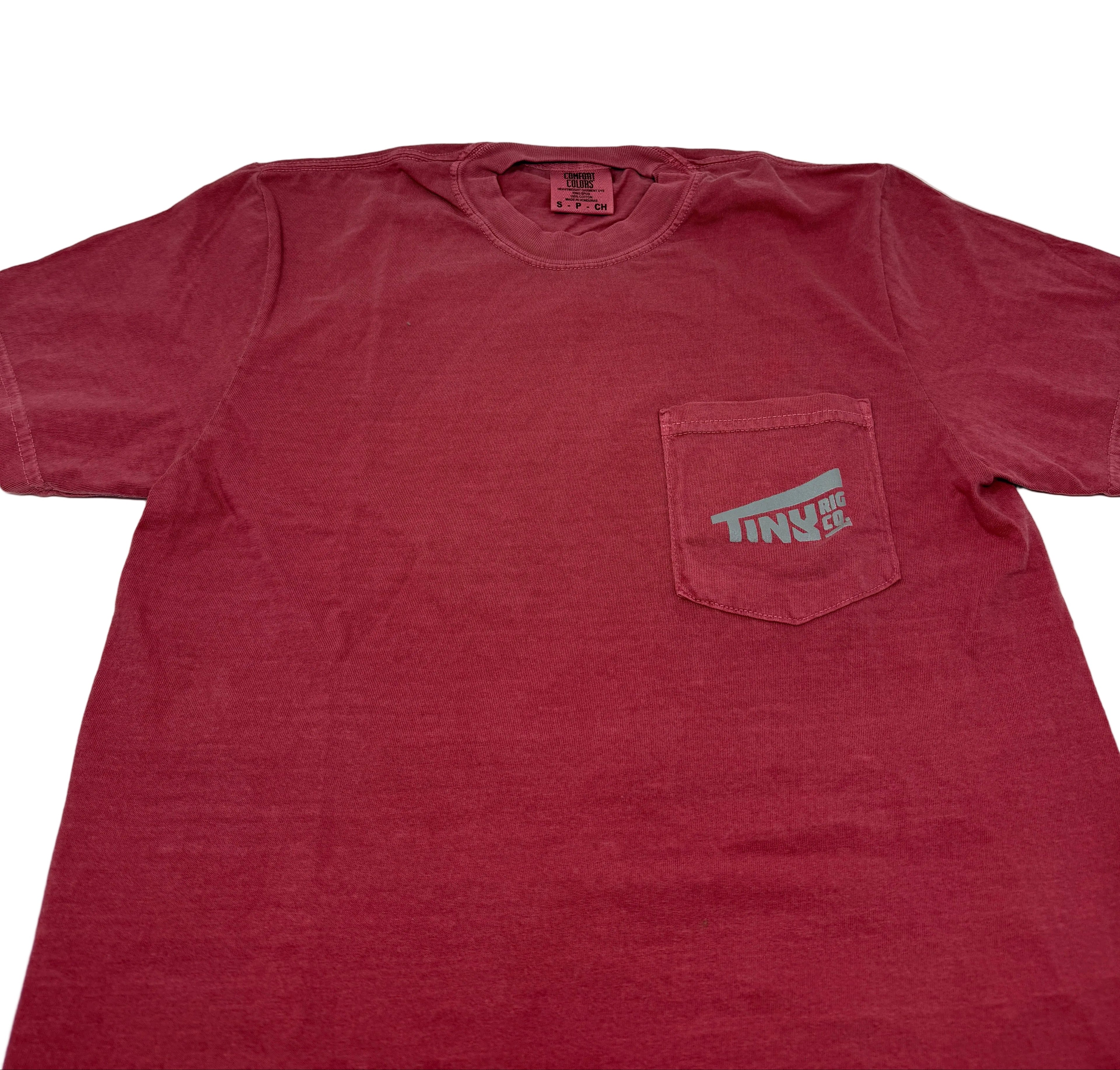 Red t-shirt with a pocket and logo on a white background